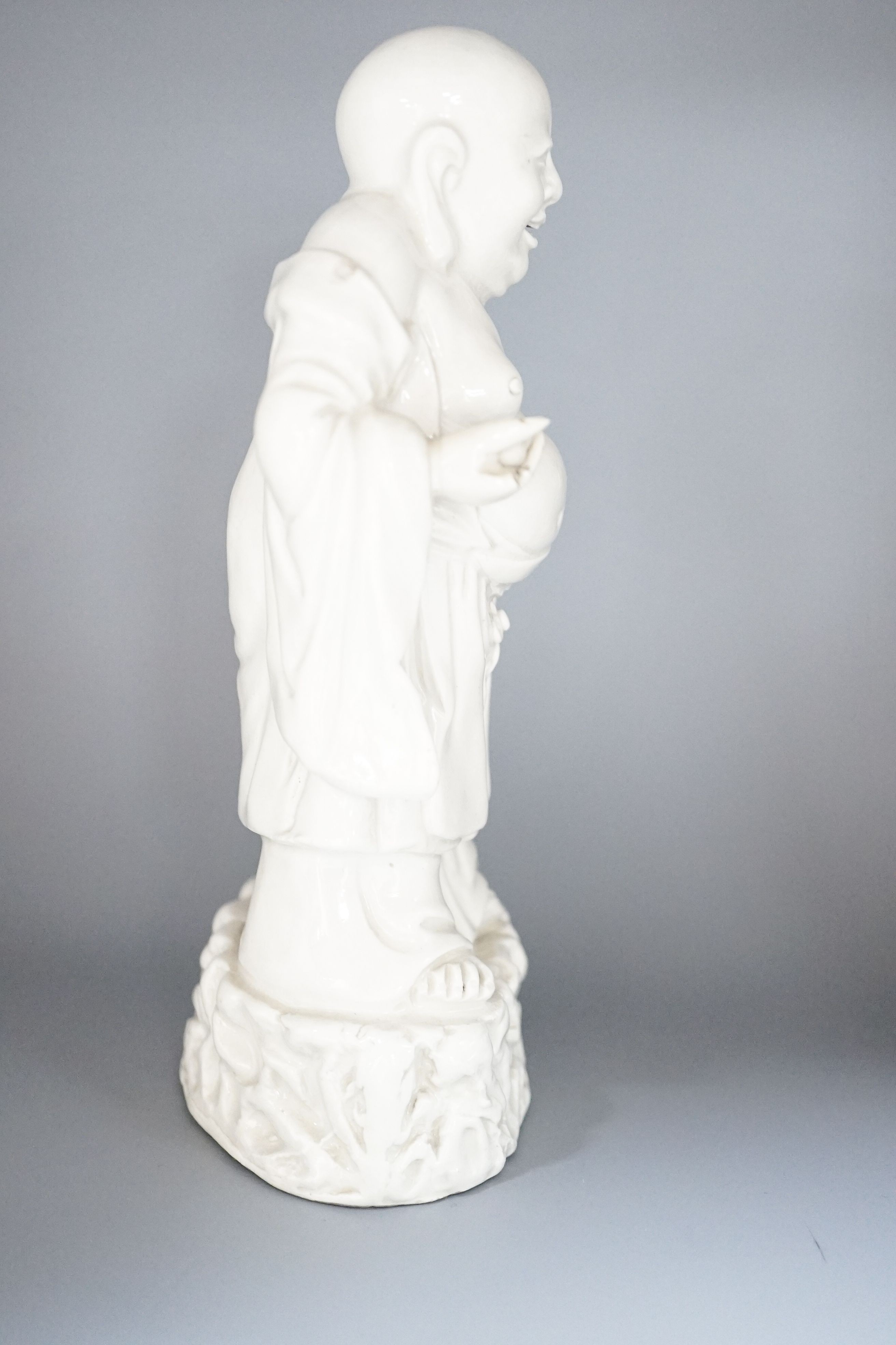 A Chinese blanc-de-chine figure of Budai, 19cm